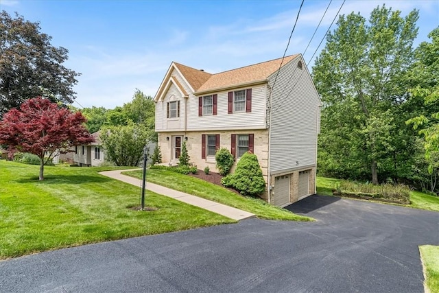 8963 Seneca Ave, Mccandless, PA 15237 - colonial inspired home featuring an attached garage, asphalt driveway, and a front lawn