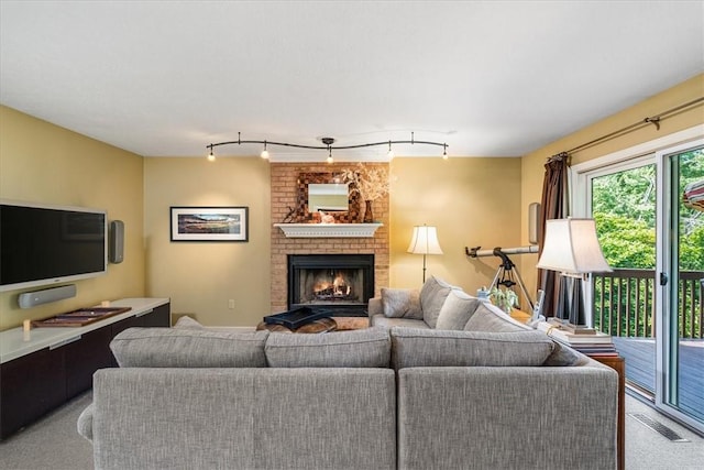 8963 Seneca Ave, Mccandless, PA 15237 - living room with a fireplace, light carpet, and rail lighting
