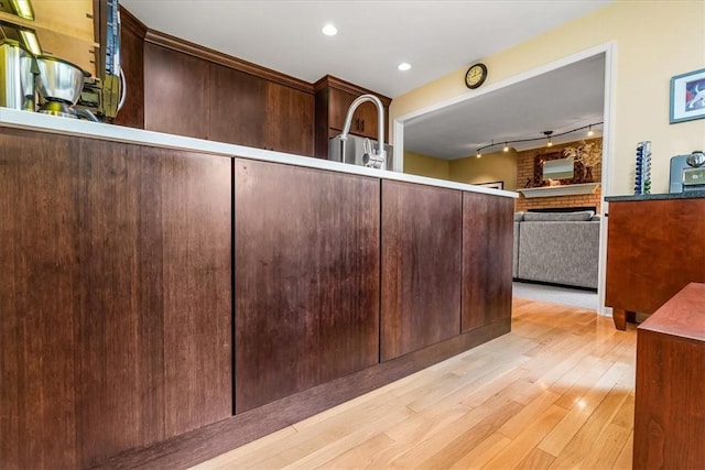 8963 Seneca Ave, Mccandless, PA 15237 - kitchen featuring light wood-style flooring, open floor plan, dark brown cabinets, and recessed lighting