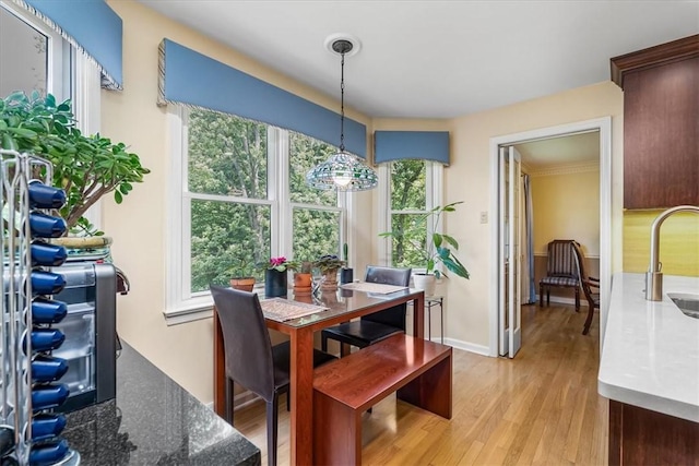 8963 Seneca Ave, Mccandless, PA 15237 - dining space featuring light wood-style flooring and baseboards