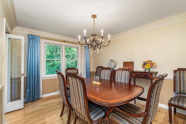 8963 Seneca Ave, Mccandless, PA 15237 - dining area featuring a chandelier, baseboards, light wood-style flooring, and ornamental molding