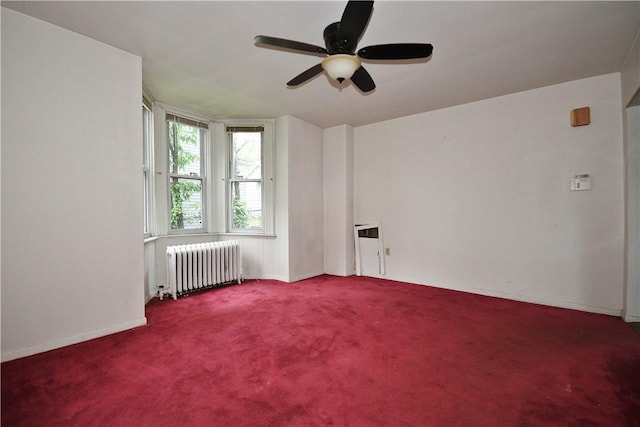 4605 2nd St, Versailles Boro, PA 15132 - carpeted empty room with radiator, ceiling fan, and baseboards