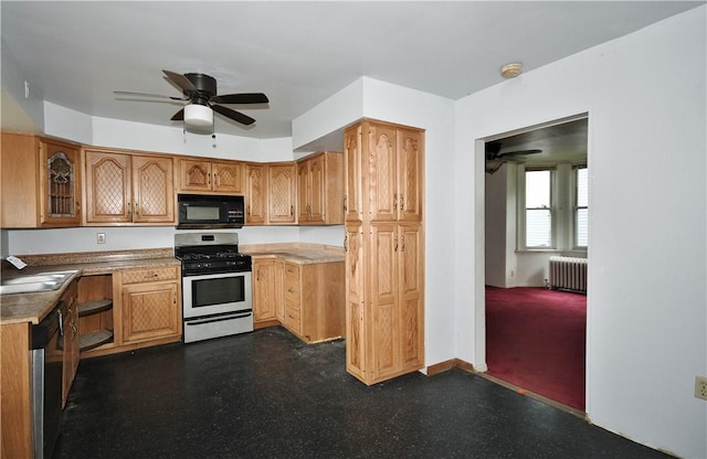 4605 2nd St, Versailles Boro, PA 15132 - kitchen with appliances with stainless steel finishes, radiator, a ceiling fan, and a sink