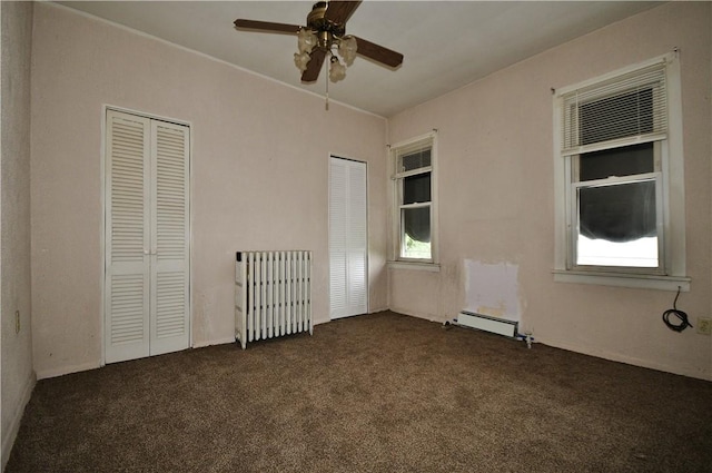 4605 2nd St, Versailles Boro, PA 15132 - unfurnished room with dark carpet, ceiling fan, radiator heating unit, and a baseboard radiator