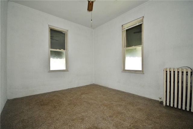 4605 2nd St, Versailles Boro, PA 15132 - carpeted empty room featuring radiator and a ceiling fan