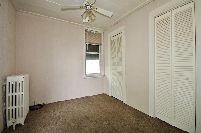 4605 2nd St, Versailles Boro, PA 15132 - unfurnished bedroom featuring radiator, dark colored carpet, and ceiling fan