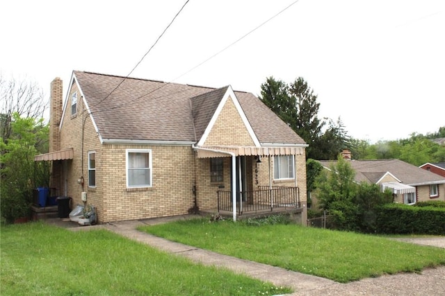1623 Barbadoes Ave, Brookline, PA 15226 - view of front of house featuring a front yard, brick siding, roof with shingles, and a chimney