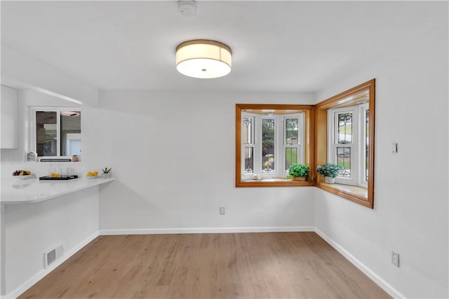 9830 Don Dr, North Huntingdon, PA 15642 - unfurnished dining area featuring wood finished floors and baseboards
