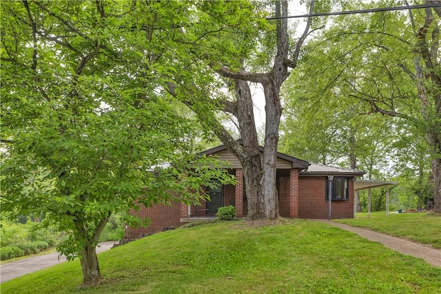 9830 Don Dr, North Huntingdon, PA 15642 - view of front of home featuring a front yard and brick siding