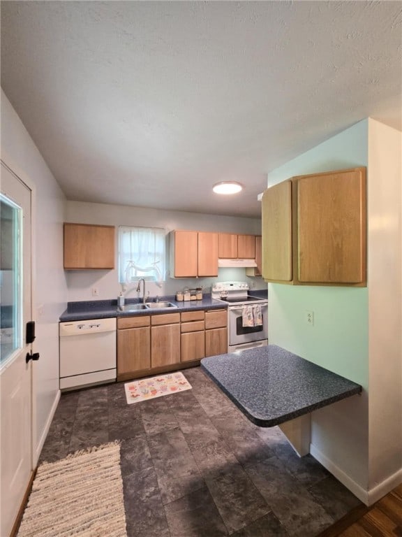 229 Chamberlain St, Allegheny Twp Wml, PA 15656 - kitchen with electric range, white dishwasher, dark countertops, and baseboards