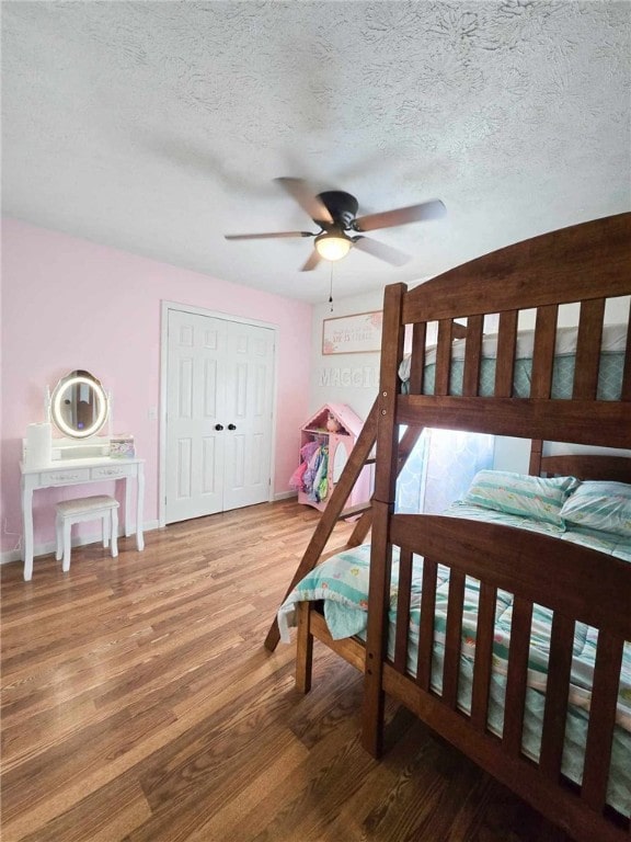 229 Chamberlain St, Allegheny Twp Wml, PA 15656 - bedroom with wood finished floors, a textured ceiling, ceiling fan, baseboards, and a closet