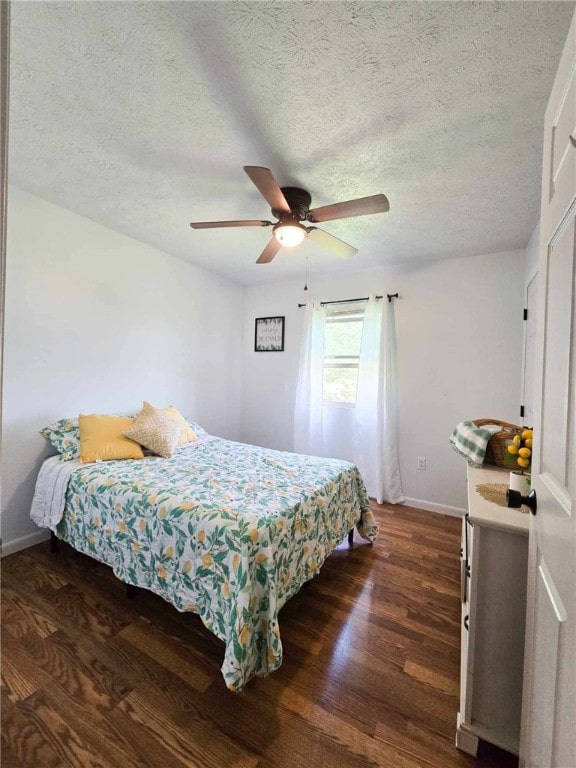 229 Chamberlain St, Allegheny Twp Wml, PA 15656 - bedroom with dark wood-type flooring, baseboards, a textured ceiling, and a ceiling fan