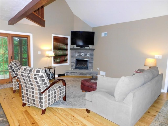 277 Dunn Rd, Hempfield Twp Wml, PA 15601 - living area featuring wood finished floors, a glass covered fireplace, and baseboards