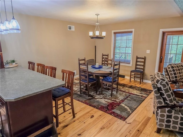 277 Dunn Rd, Hempfield Twp Wml, PA 15601 - dining area with hardwood / wood-style flooring, baseboards, and a chandelier