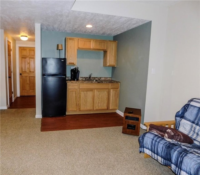 277 Dunn Rd, Hempfield Twp Wml, PA 15601 - kitchen with freestanding refrigerator, a sink, dark colored carpet, and baseboards