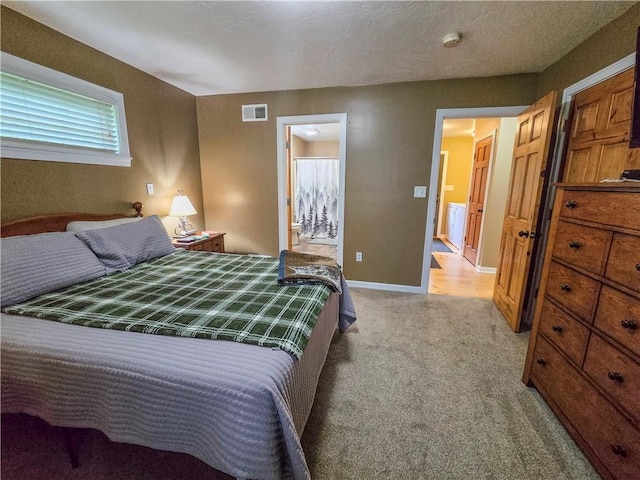 277 Dunn Rd, Hempfield Twp Wml, PA 15601 - bedroom with light colored carpet, baseboards, and connected bathroom