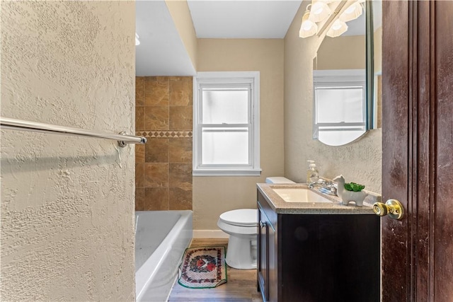 707 Hamil Rd, Penn Hills, PA 15147 - full bathroom with vanity, wood finished floors, and a textured wall