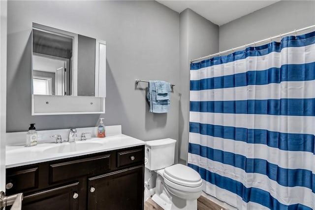305 Tillary Ln Unit 202, Cranberry Twp, PA 16066 - full bathroom with toilet, vanity, wood finished floors, and curtained shower