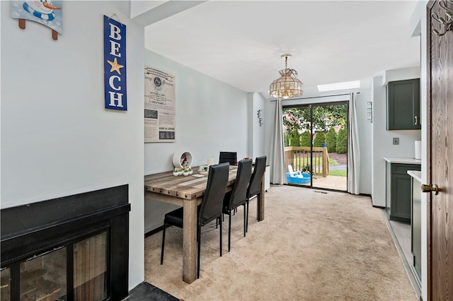 303 Serendipity Dr, Moon/Crescent Twp, PA 15108 - dining space featuring light colored carpet and a chandelier