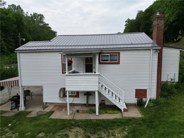 1467 Hayden Blvd, Elizabeth Twp/Boro, PA 15037 - back of property featuring stairs, metal roof, a patio area, and a lawn
