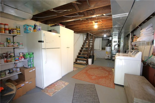 1467 Hayden Blvd, Elizabeth Twp/Boro, PA 15037 - unfinished below grade area featuring gas water heater, stairway, freestanding refrigerator, washer and dryer, and heating unit