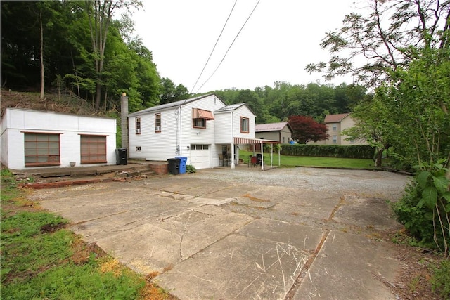 1467 Hayden Blvd, Elizabeth Twp/Boro, PA 15037 - view of property exterior featuring driveway and a garage