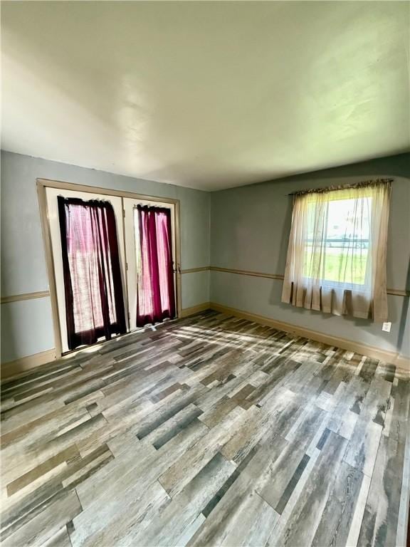 210 Griscom St, Dawson, PA 15428 - empty room featuring wood finished floors and baseboards