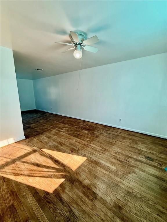 210 Griscom St, Dawson, PA 15428 - empty room with wood-type flooring, baseboards, and a ceiling fan