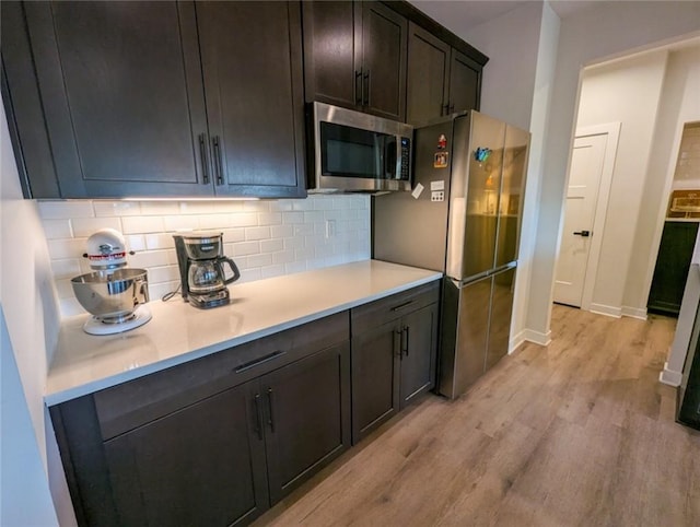 137 Red Horse Dr, Buffalo Twp But, PA 16055 - kitchen with stainless steel appliances, light wood-type flooring, decorative backsplash, light countertops, and baseboards