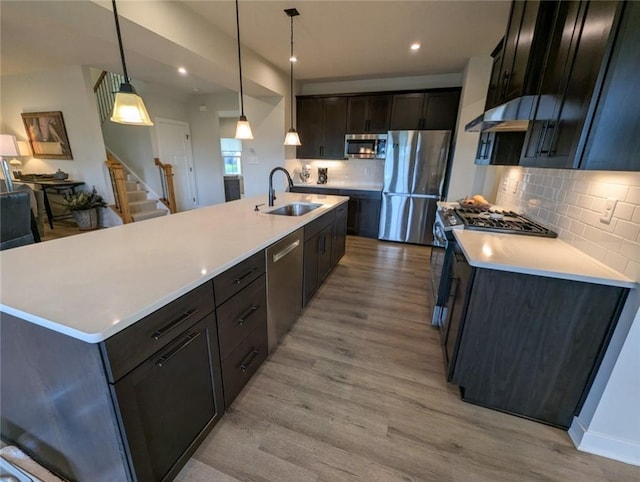 137 Red Horse Dr, Buffalo Twp But, PA 16055 - kitchen featuring stainless steel appliances, a sink, light wood-style floors, backsplash, and recessed lighting