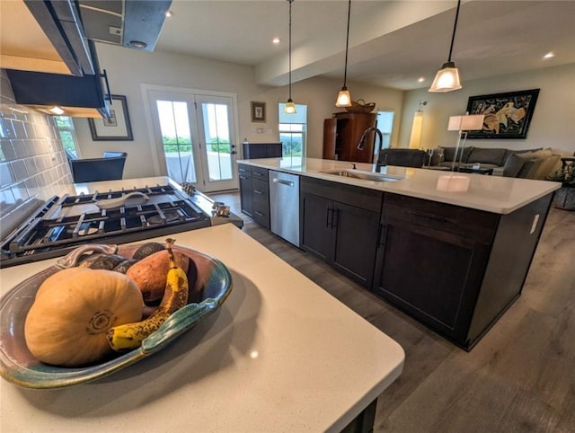 137 Red Horse Dr, Buffalo Twp But, PA 16055 - kitchen with stainless steel dishwasher, a sink, light countertops, dark wood-style flooring, and a kitchen island with sink