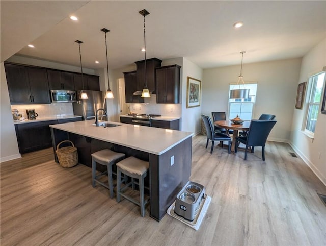 137 Red Horse Dr, Buffalo Twp But, PA 16055 - kitchen featuring appliances with stainless steel finishes, a sink, light wood-style floors, light countertops, and recessed lighting