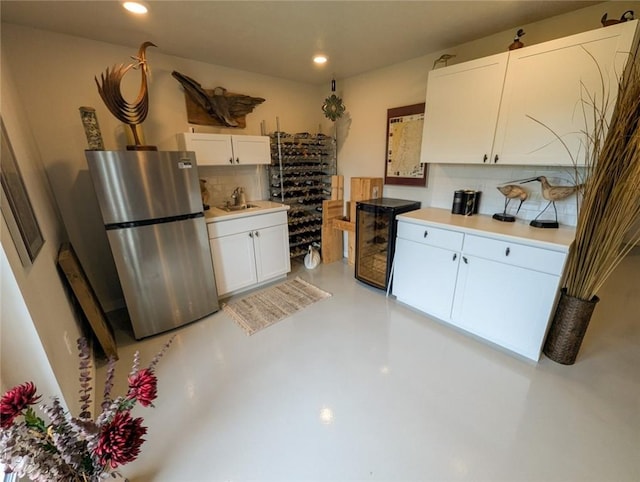 137 Red Horse Dr, Buffalo Twp But, PA 16055 - kitchen with freestanding refrigerator, tasteful backsplash, concrete floors, white cabinetry, and recessed lighting