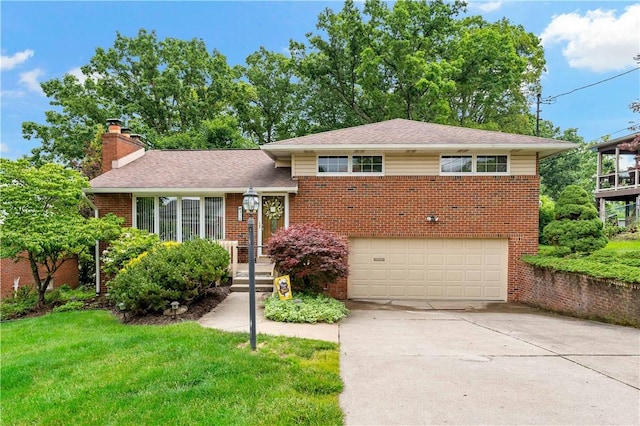 315 Yarrow Ln, Pleasant Hills, PA 15236 - tri-level home featuring a chimney, a garage, brick siding, and driveway