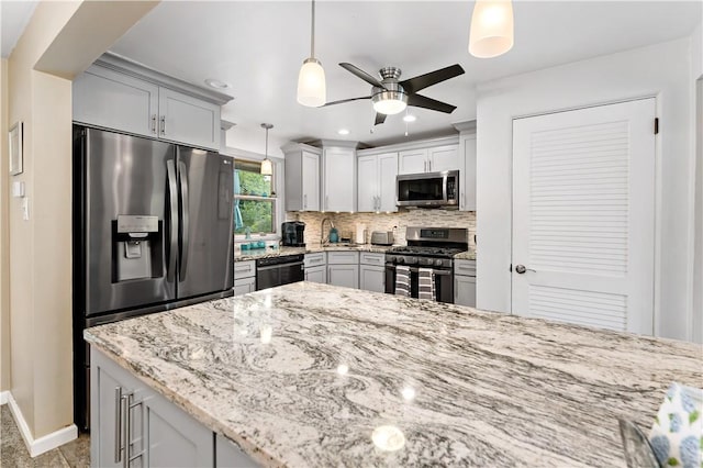 315 Yarrow Ln, Pleasant Hills, PA 15236 - kitchen with stainless steel appliances, a ceiling fan, decorative backsplash, baseboards, and light stone countertops