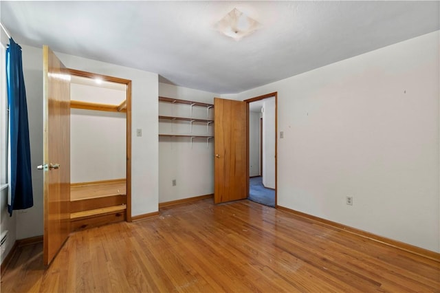 455 Darrell Dr, Penn Hills, PA 15235 - unfurnished bedroom featuring light wood-style flooring, baseboards, and a closet