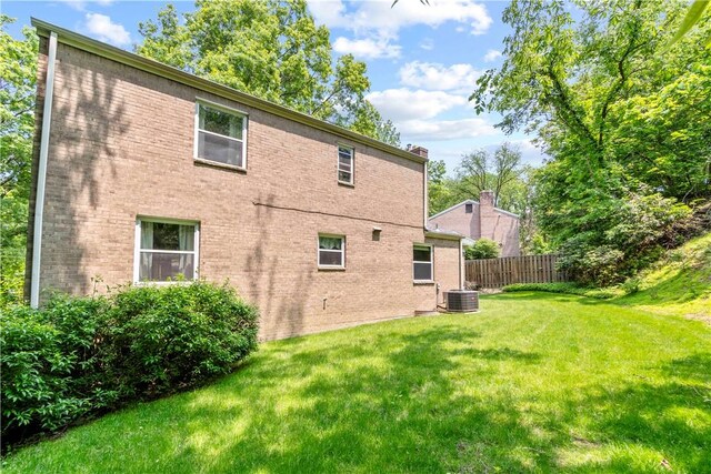 455 Darrell Dr, Penn Hills, PA 15235 - back of house with central AC unit and brick siding