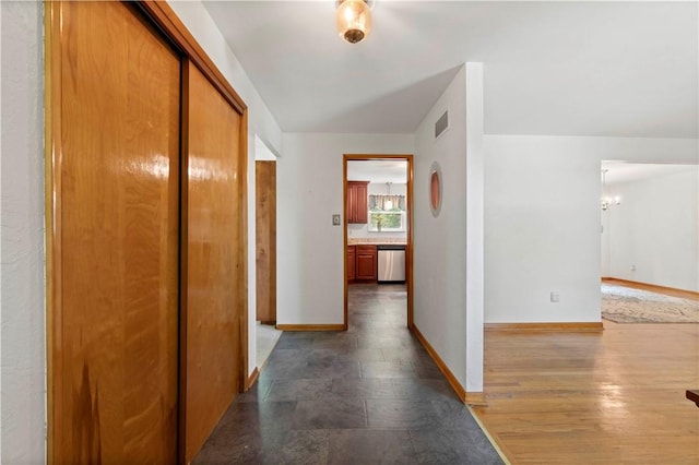 455 Darrell Dr, Penn Hills, PA 15235 - hall featuring baseboards and a chandelier