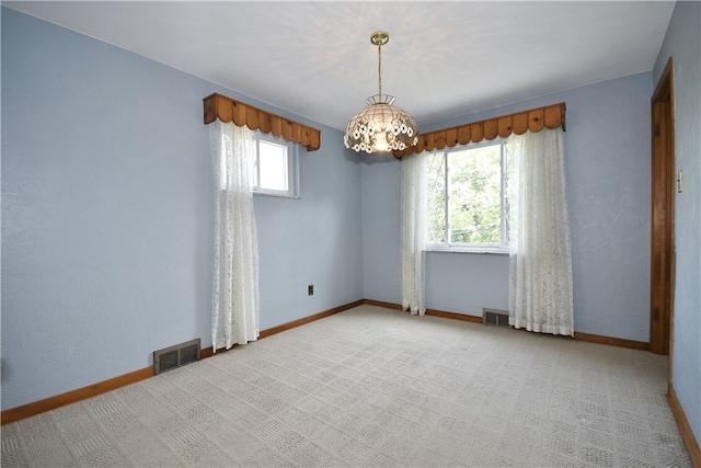 3743 Grant St, Castle Shannon, PA 15234 - spare room featuring a chandelier, baseboards, and light carpet
