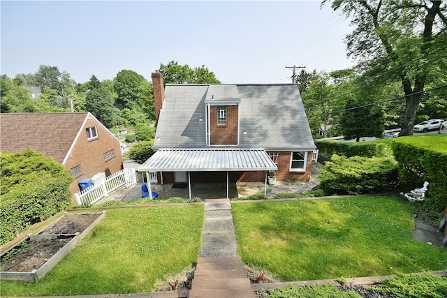 3743 Grant St, Castle Shannon, PA 15234 - a-frame home featuring a vegetable garden, a chimney, brick siding, and covered porch