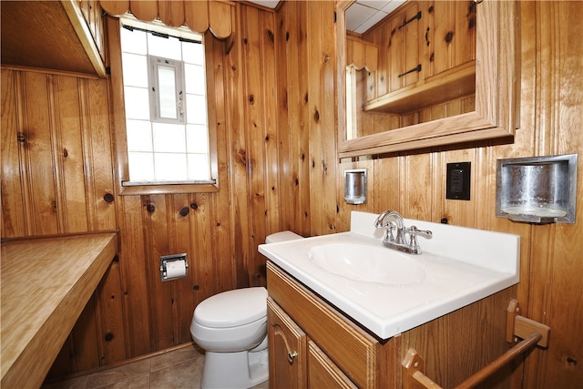 3743 Grant St, Castle Shannon, PA 15234 - half bathroom with vanity, toilet, wooden walls, and tile patterned flooring
