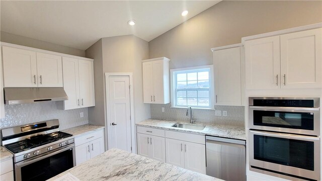 168 Twin Oaks Dr, Buffalo Twp, PA 16055 - kitchen featuring stainless steel appliances, exhaust hood, white cabinetry, decorative backsplash, and recessed lighting