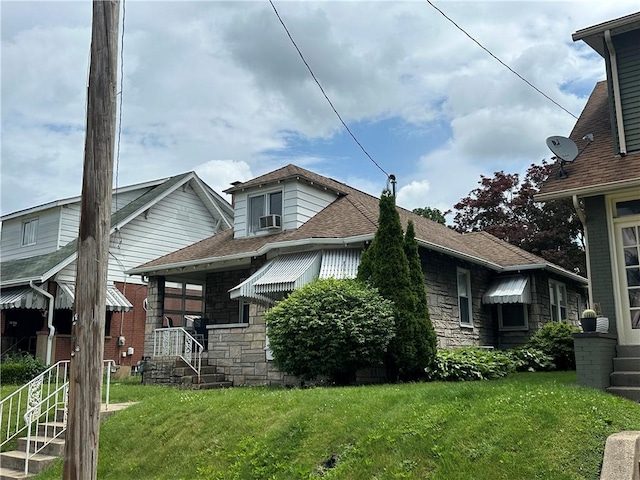 1810 Ridge Ave, Arnold, PA 15068 - view of side of property with stone siding, a yard, and roof with shingles