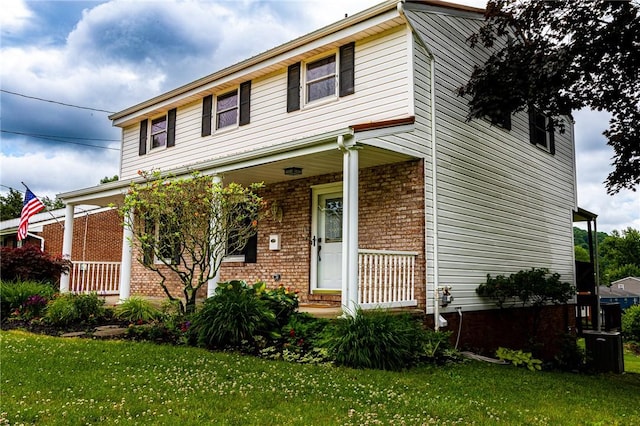 2678 Elaine Dr, Lower Burrell, PA 15068 - view of front of home with a porch, a front lawn, and brick siding
