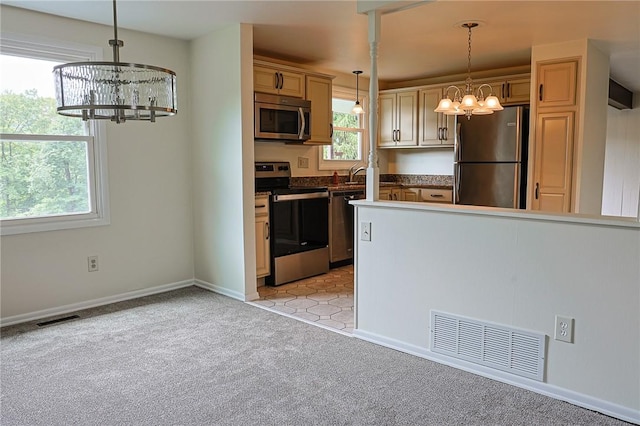 2678 Elaine Dr, Lower Burrell, PA 15068 - kitchen featuring stainless steel appliances, a chandelier, light carpet, and pendant lighting