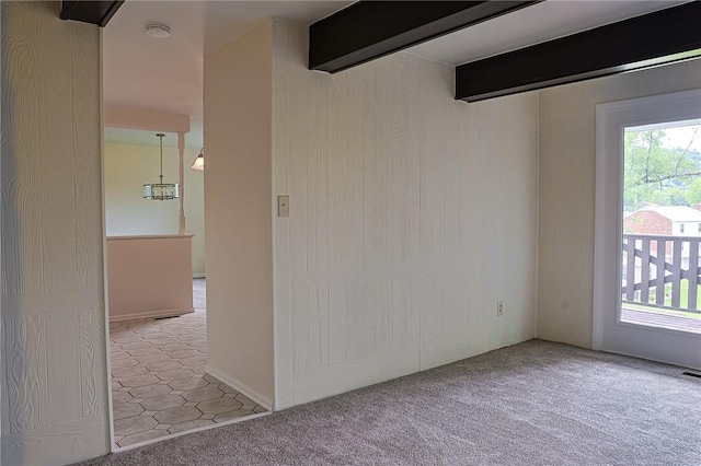 2678 Elaine Dr, Lower Burrell, PA 15068 - carpeted empty room with a smoke detector and beamed ceiling