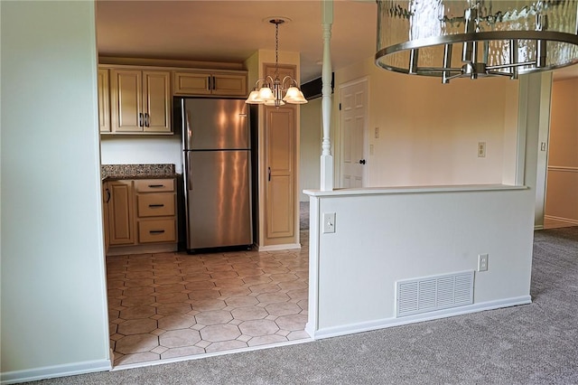 2678 Elaine Dr, Lower Burrell, PA 15068 - kitchen with freestanding refrigerator, a chandelier, and hanging light fixtures