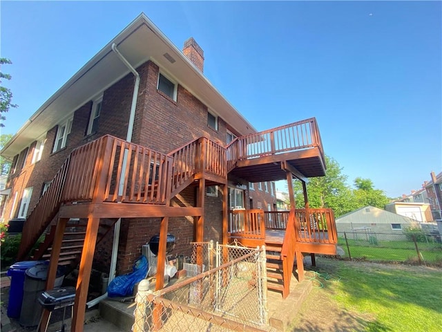 970 Lilac St, Greenfield, PA 15217 - rear view of house featuring stairway, brick siding, a deck, and a chimney