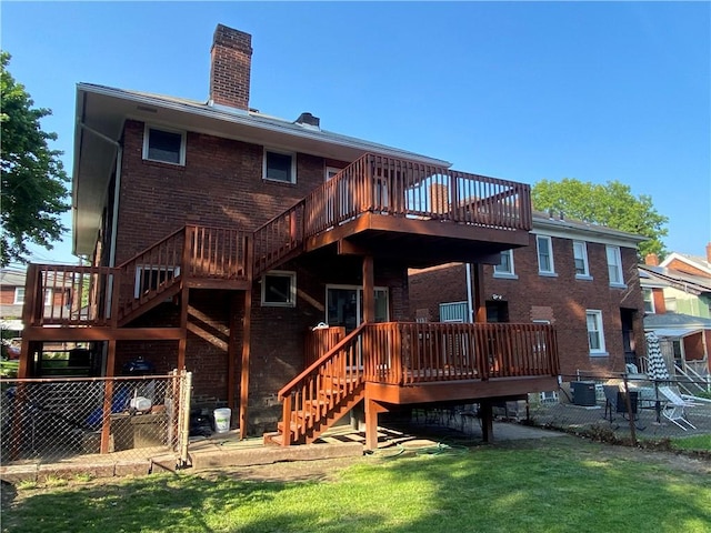 970 Lilac St, Greenfield, PA 15217 - back of property with stairs, a chimney, brick siding, and a wooden deck