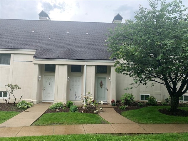 8 Ridgemead Fields Dr, Plum Boro, PA 15147 - view of front of home with roof with shingles, stucco siding, a front lawn, and a chimney